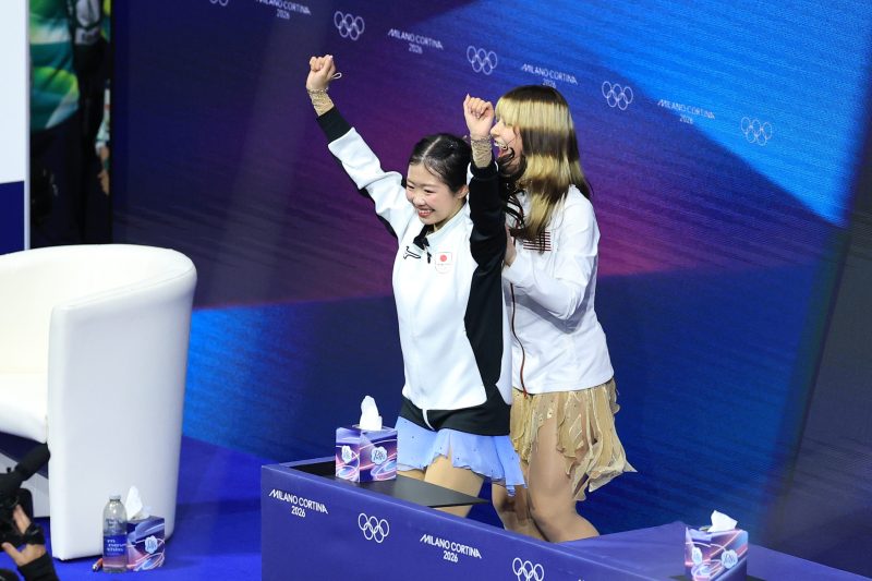 17-year-old Ami Nakai hugs Alysa Liu after both skaters medal at Olympics