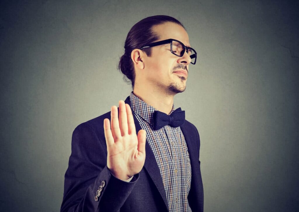 man gives stopping gesture